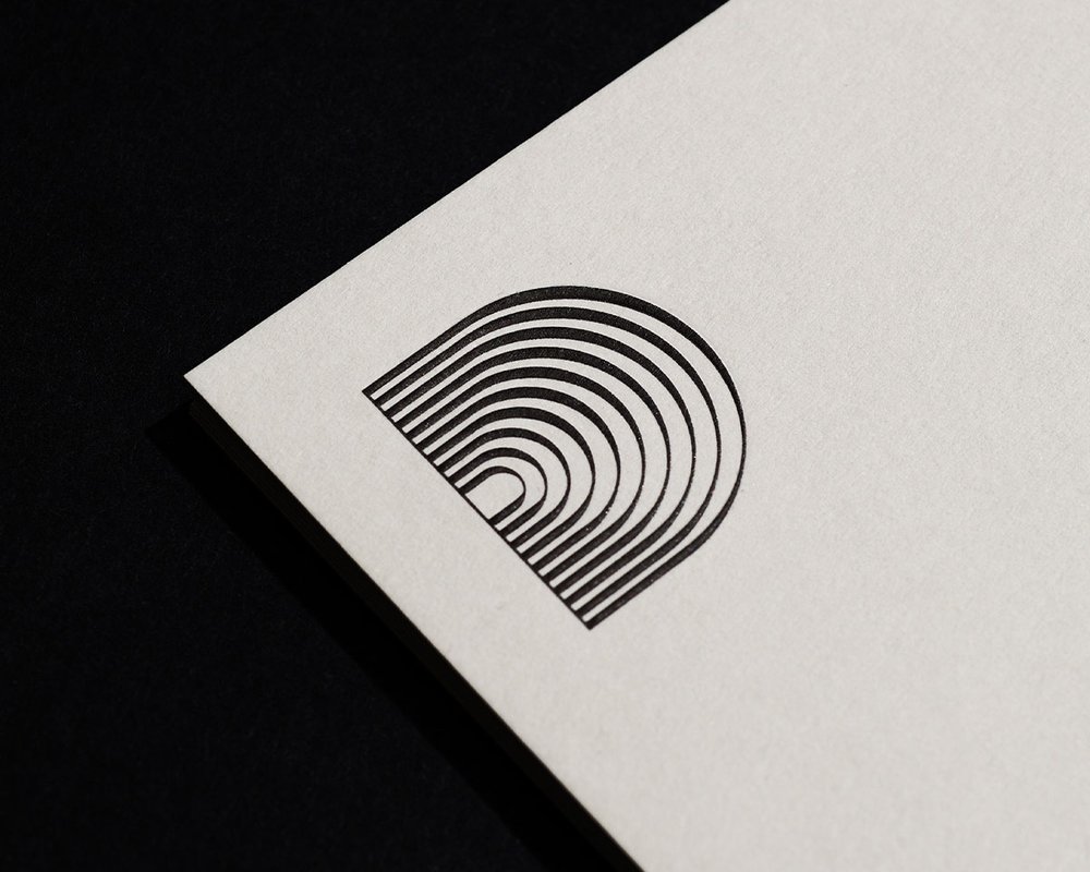 Downtown Music Group letterhead featuring custom secondary mark, designed by RoAndCo Studio