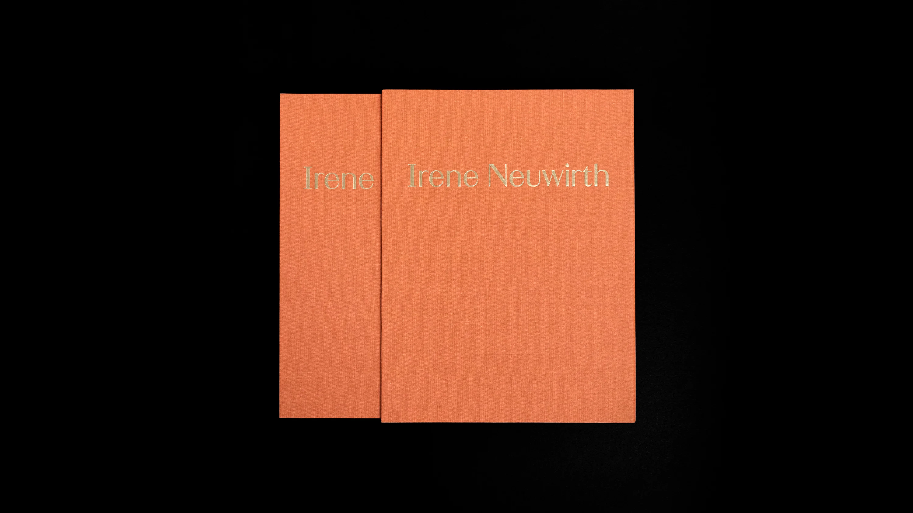 Irene Neuwirth brand book. Linen-bound, gold stamped, published by Proof 7. Irene Neuwirth gumball collection spread. Rings, necklaces, headpieces and earrings displayed on colored glasses. Art direction and print design by RoAndCo