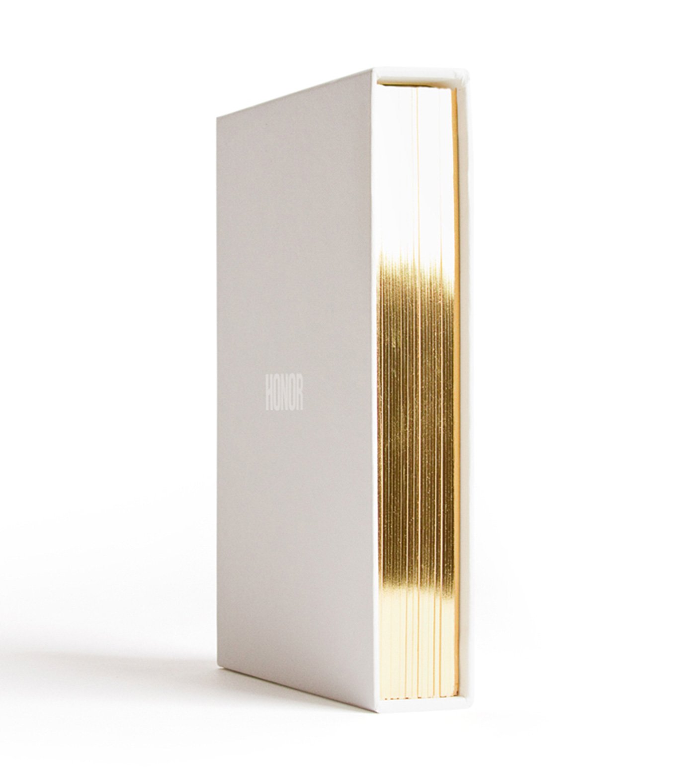 Honor Fashion Week 2010 book with gold foil edges and embossed logo, design by RoAndCo