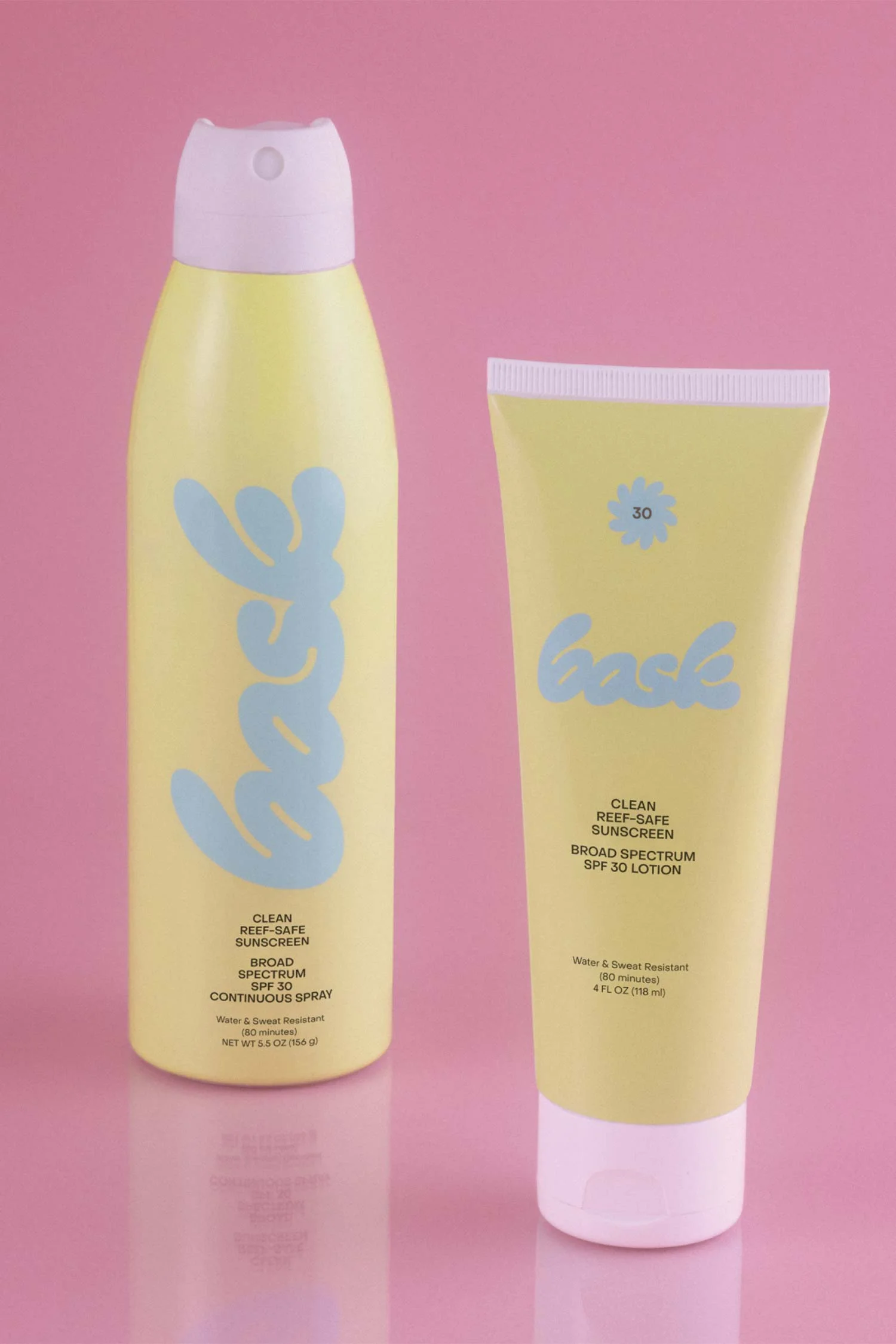 Bask Yellow Continuous Spray and Lotion Tube on a Pink background by RoAndCo