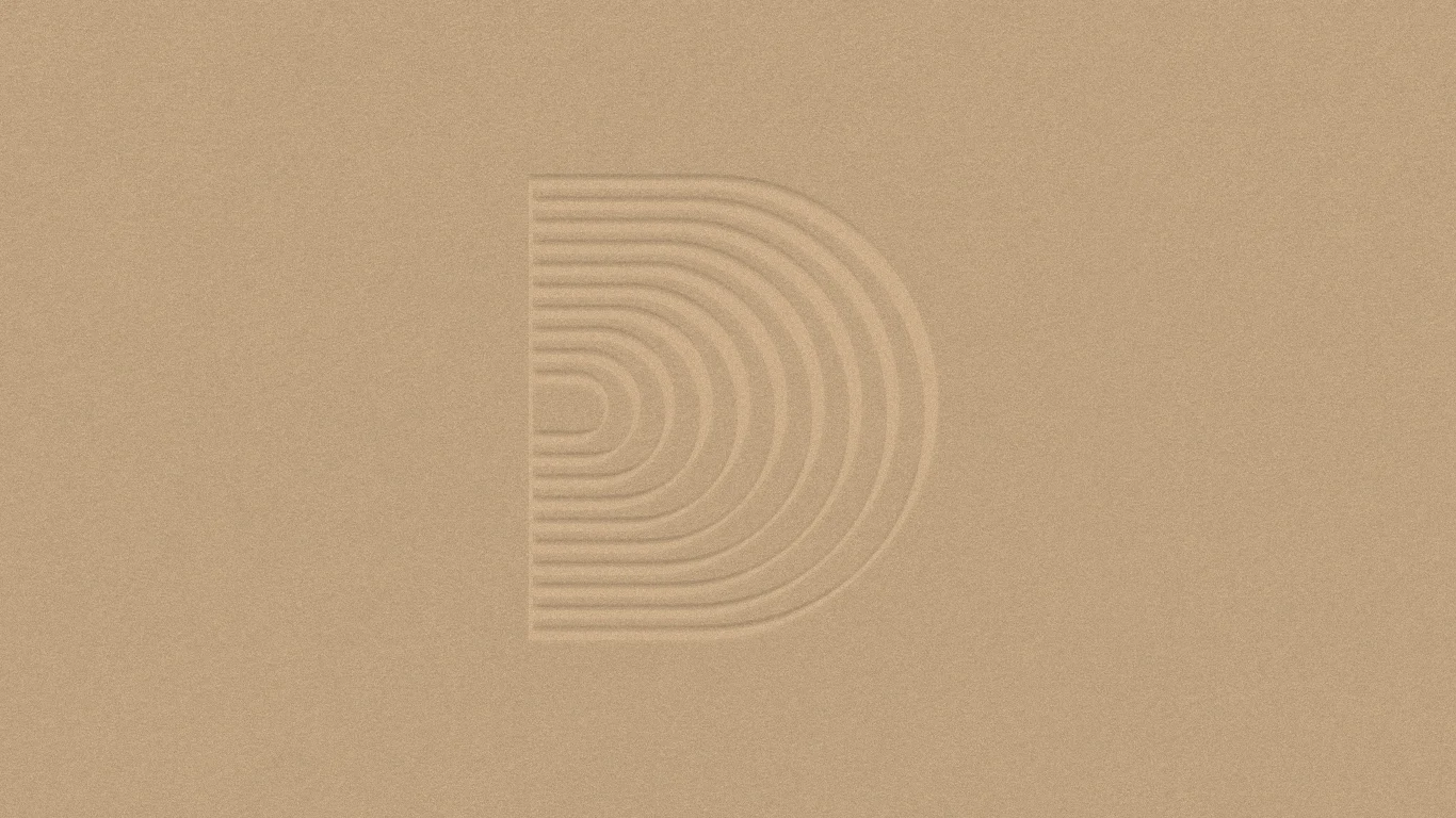 Downtown Music Group secondary mark embossed in gold on craft paper, print design by RoAndCo Studio