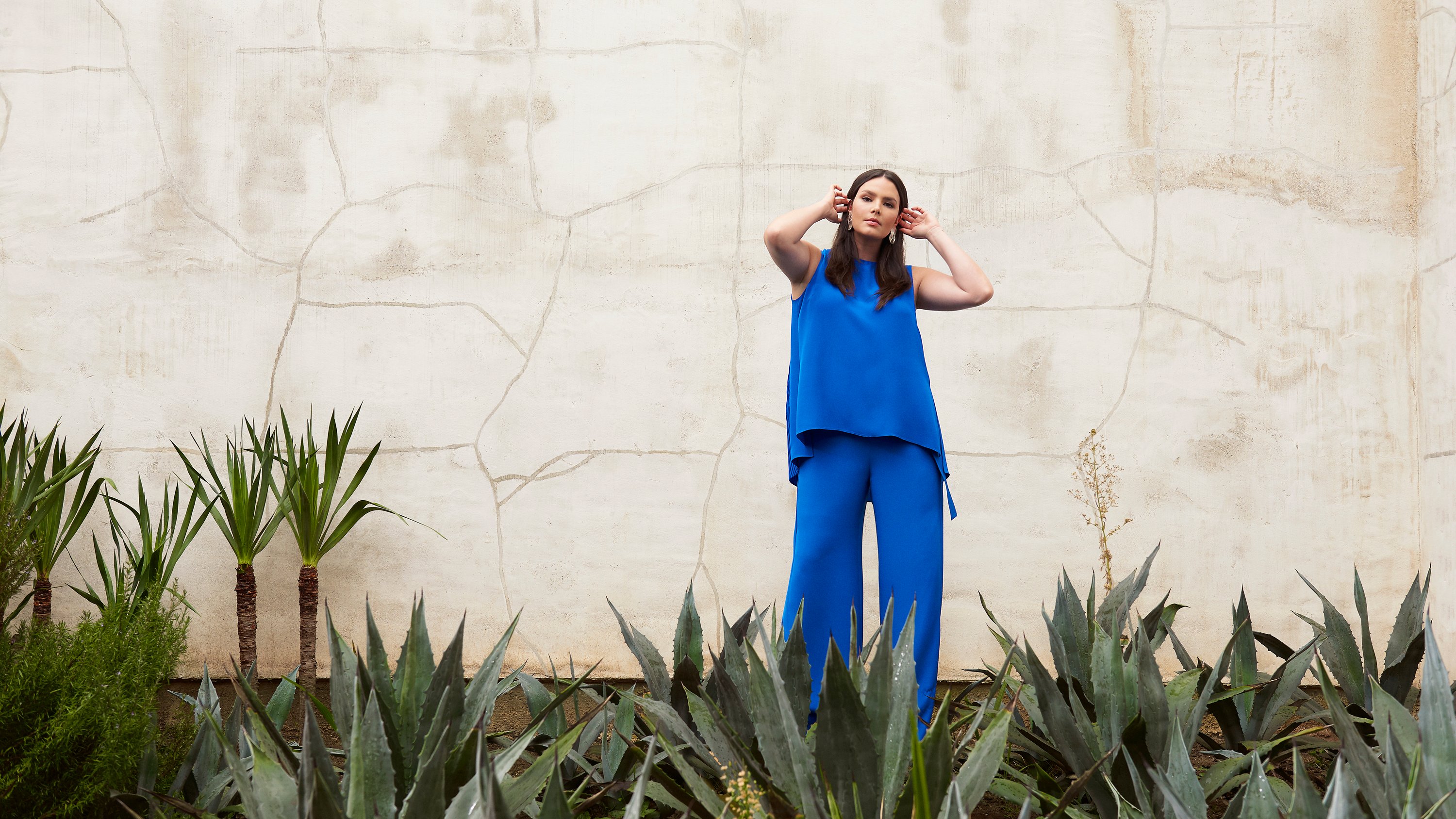 Model Candice Huffine wearing matching blue top and pants, Ad campaign. Art Direction by RoAndCo   