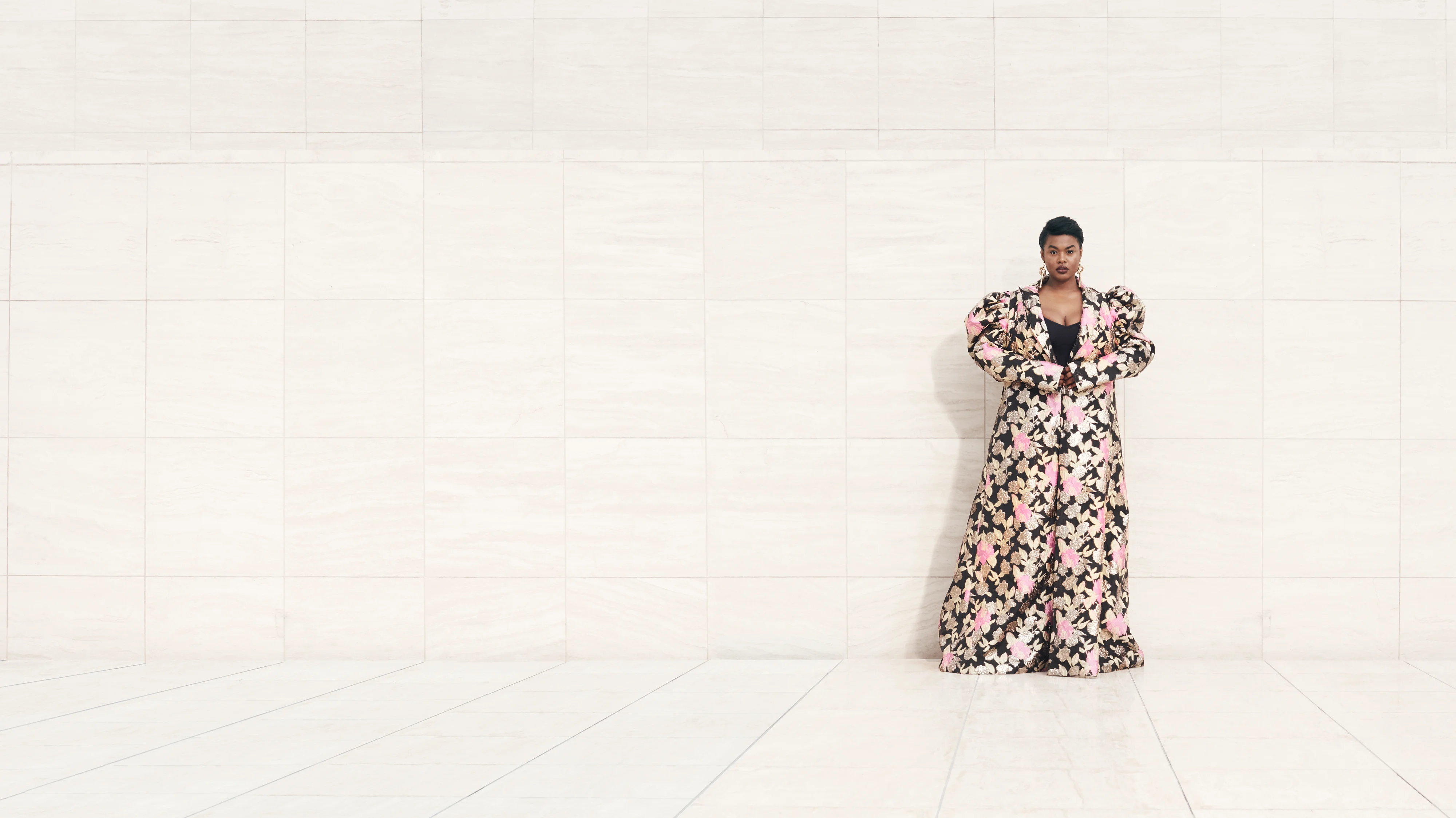 Model Precious Lee wearing floor length floral coat, Ad campaign. Art Direction by RoAndCo
