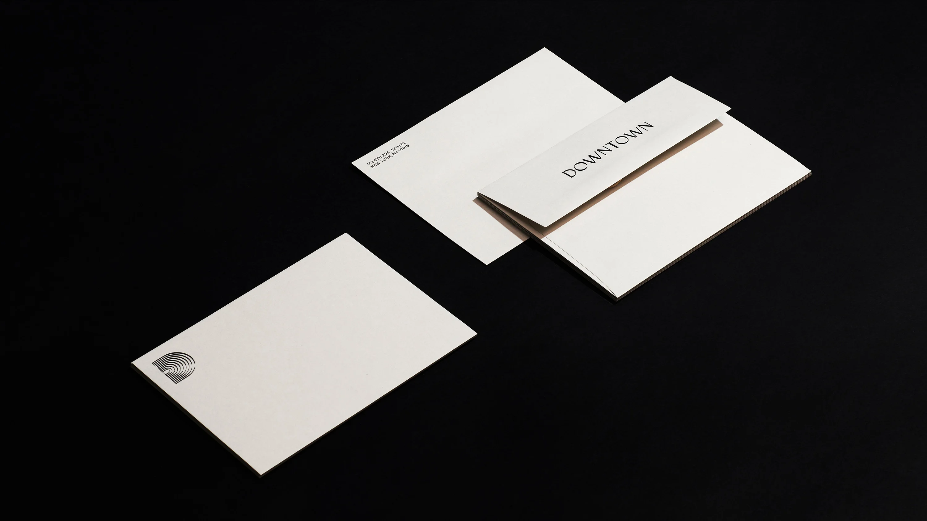 Downtown Music Group stationary envelopes in cream, print design by RoAndCo Studio