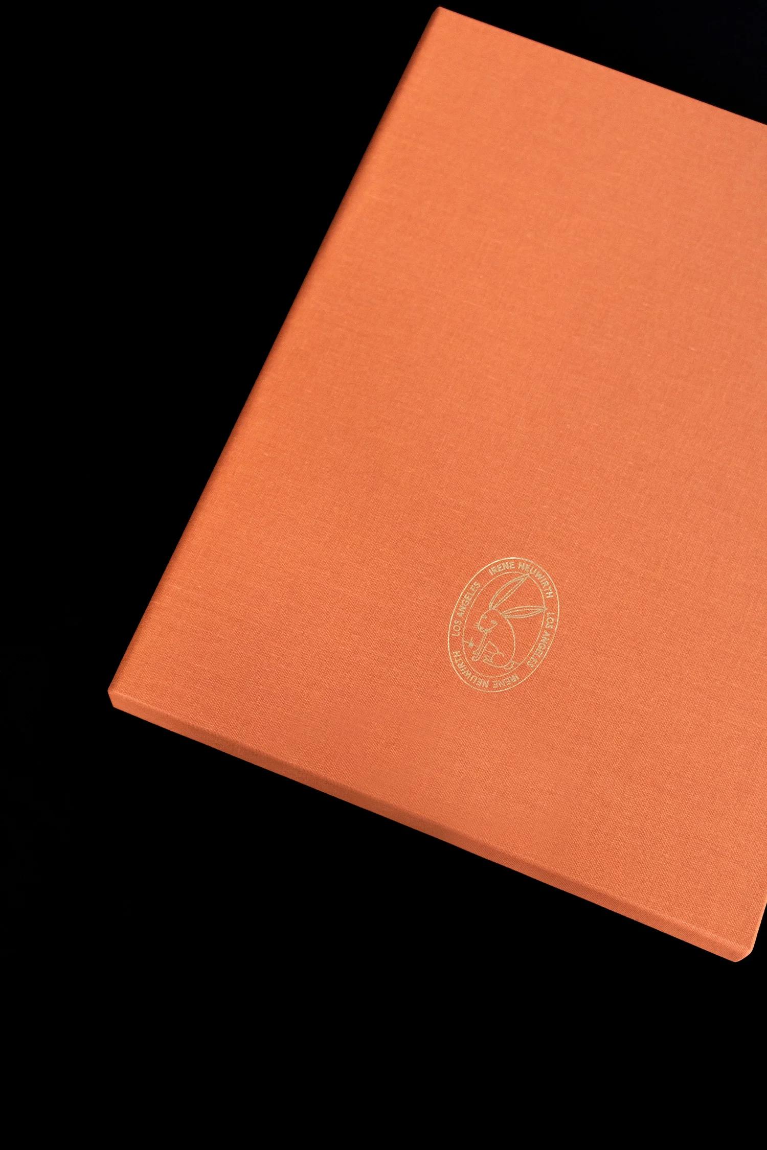 Close up of gold stamped bunny on the back of the Irene Neuwirth brand book. Art direction and print design by RoAndCo