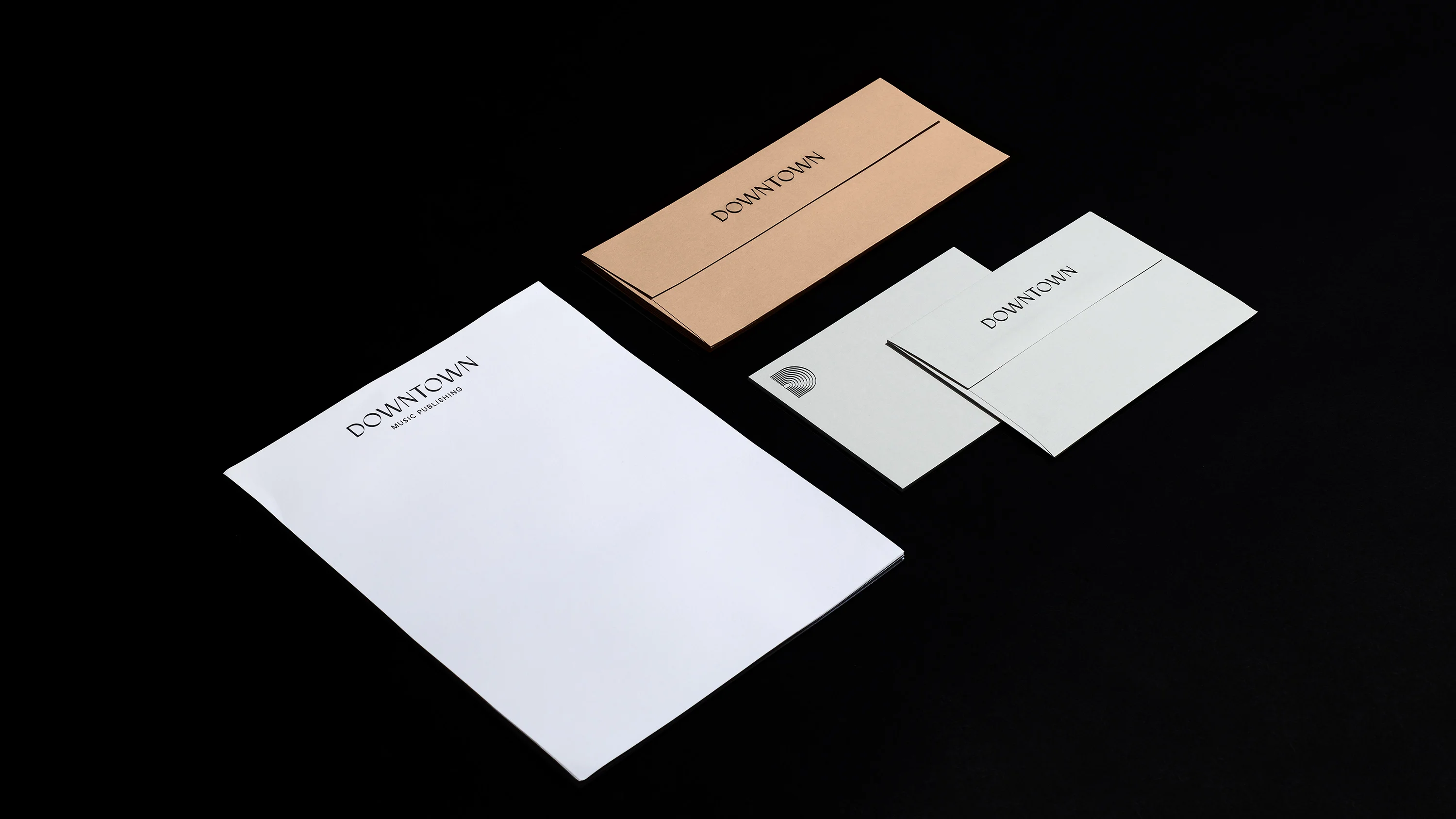 Downtown Music Group letterhead and matching envelopes, print design by RoAndCo Studio