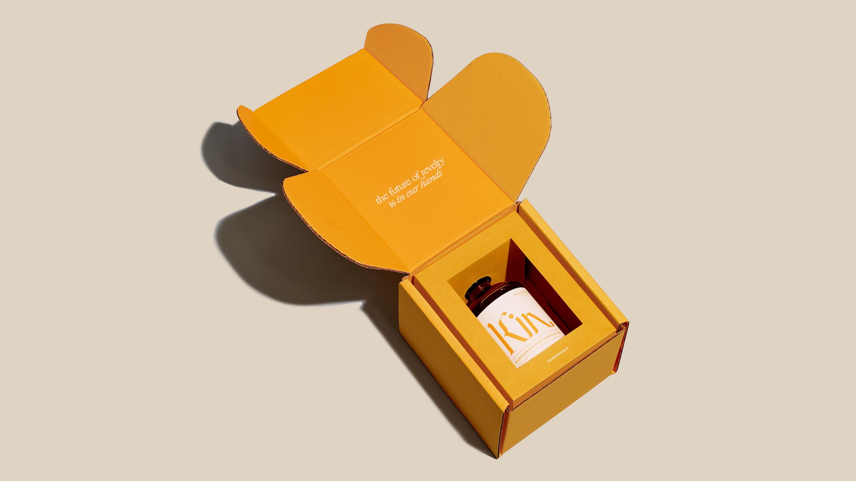 Kin Euphorics Packaging Design by RoAndCo, yellow box with bottle inside