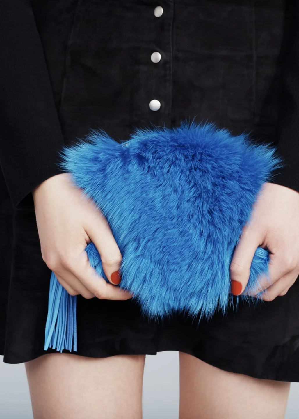 Close up of Loeffler Randall blue fur pouch. Art direction by RoAndCo