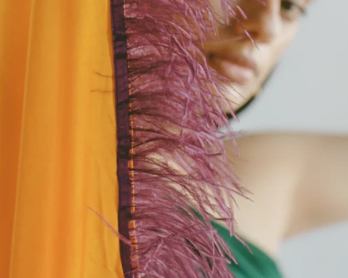 Busayo logo over Sky blue background with red and white Nigerian pattern