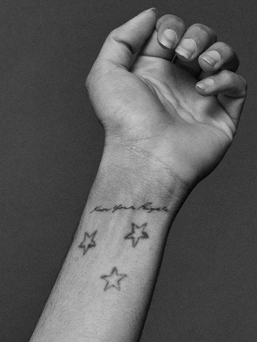 Portrait of star tattoos on woman's wrist for Romance Journal Issue 02.. Publication design, art direction, print design, interviews by RoAndCo.