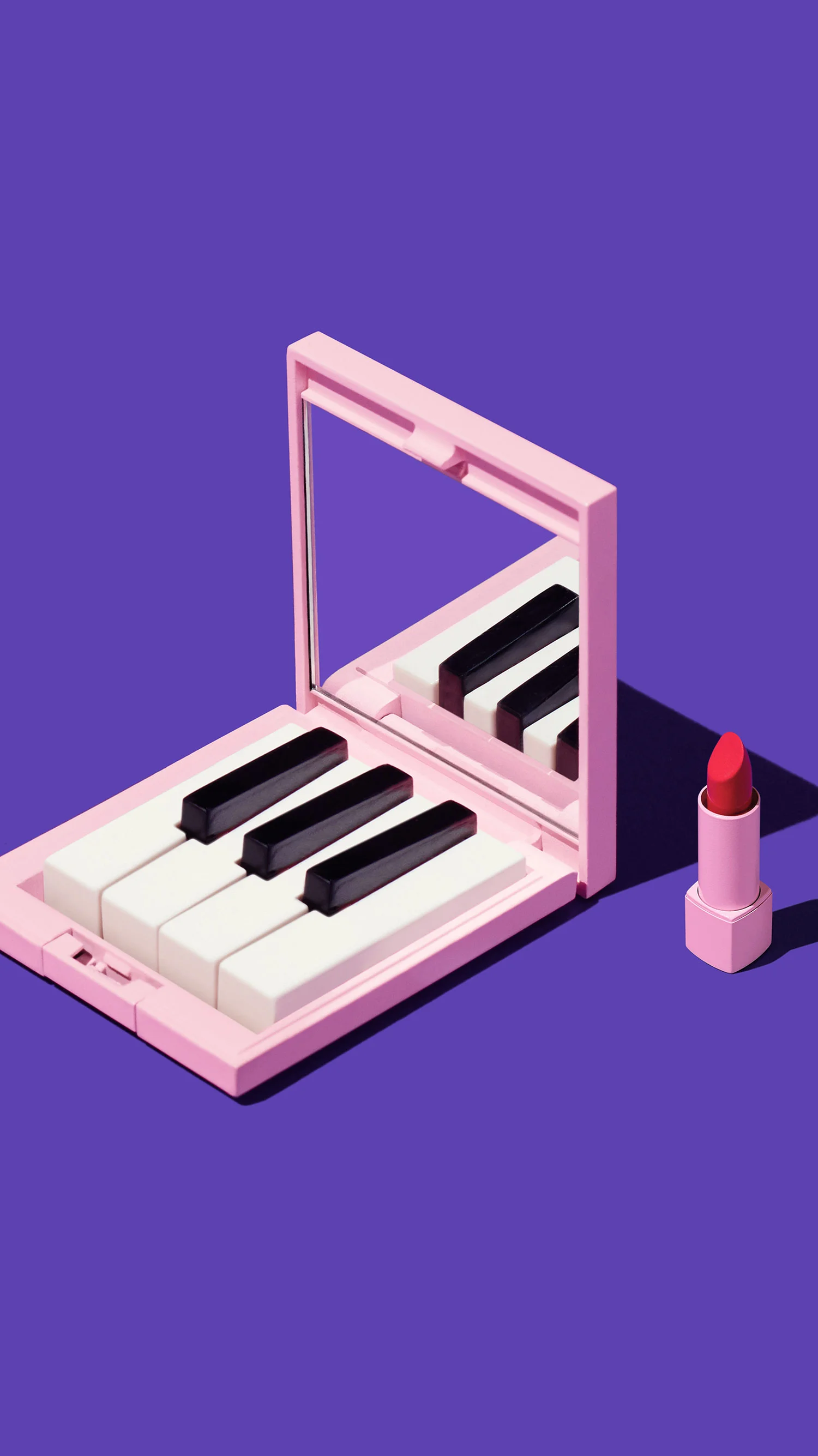 Google Play campaign ad – Mirror makeup compact with piano keys inside.