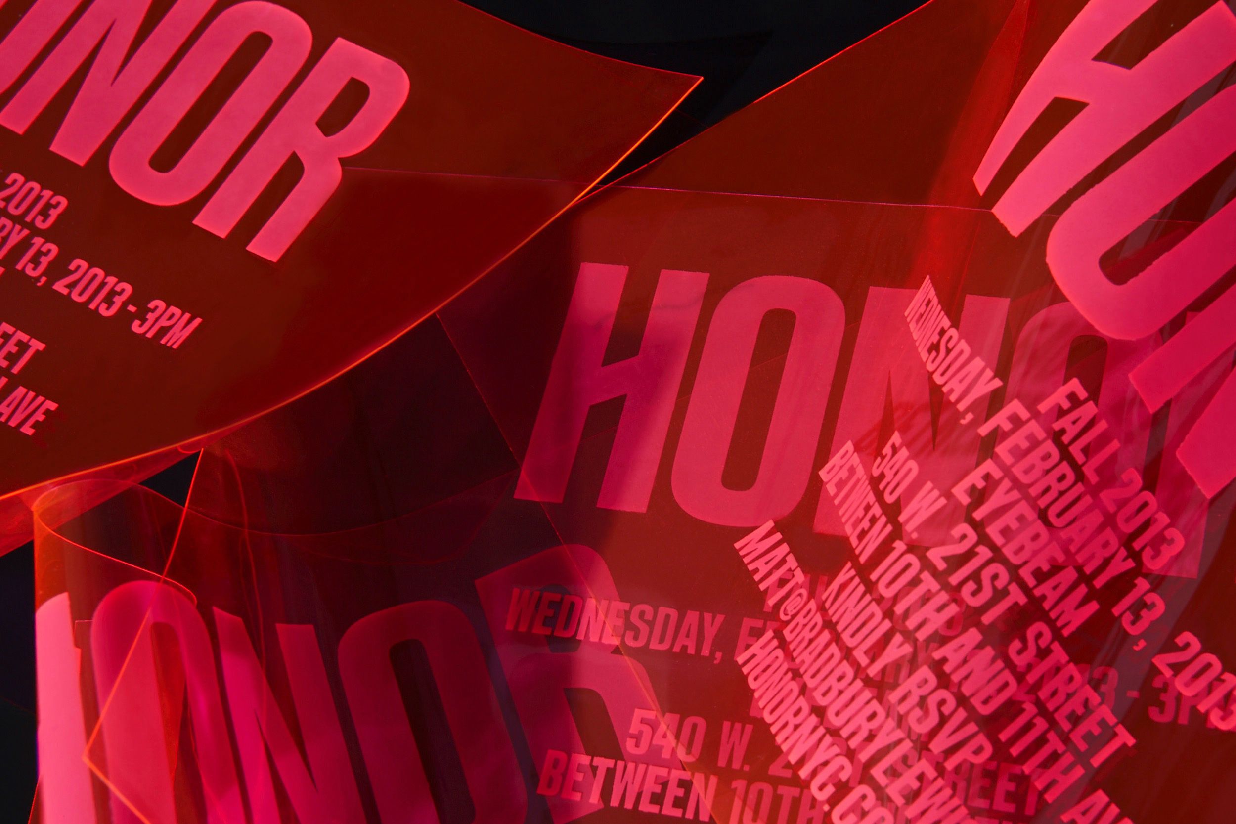 Red Honor logo on fashion show invitation, design by RoAndCo Studio
