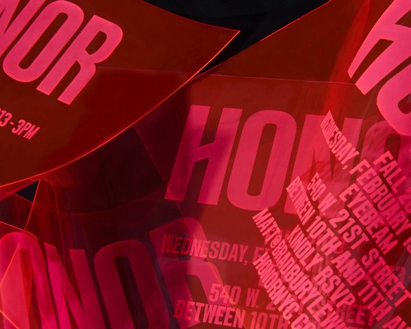 Red Honor logo on fashion show invitation, design by RoAndCo Studio
