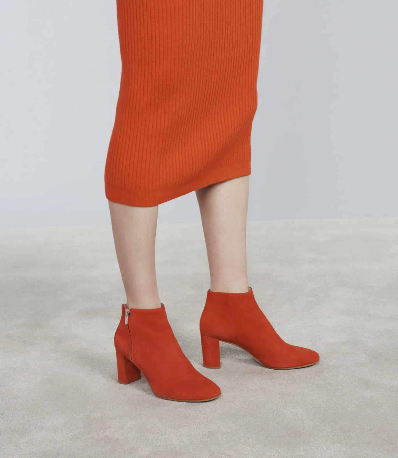 Close up of Loeffler Randall red heeled-suede-boots. Art direction by RoAndCo