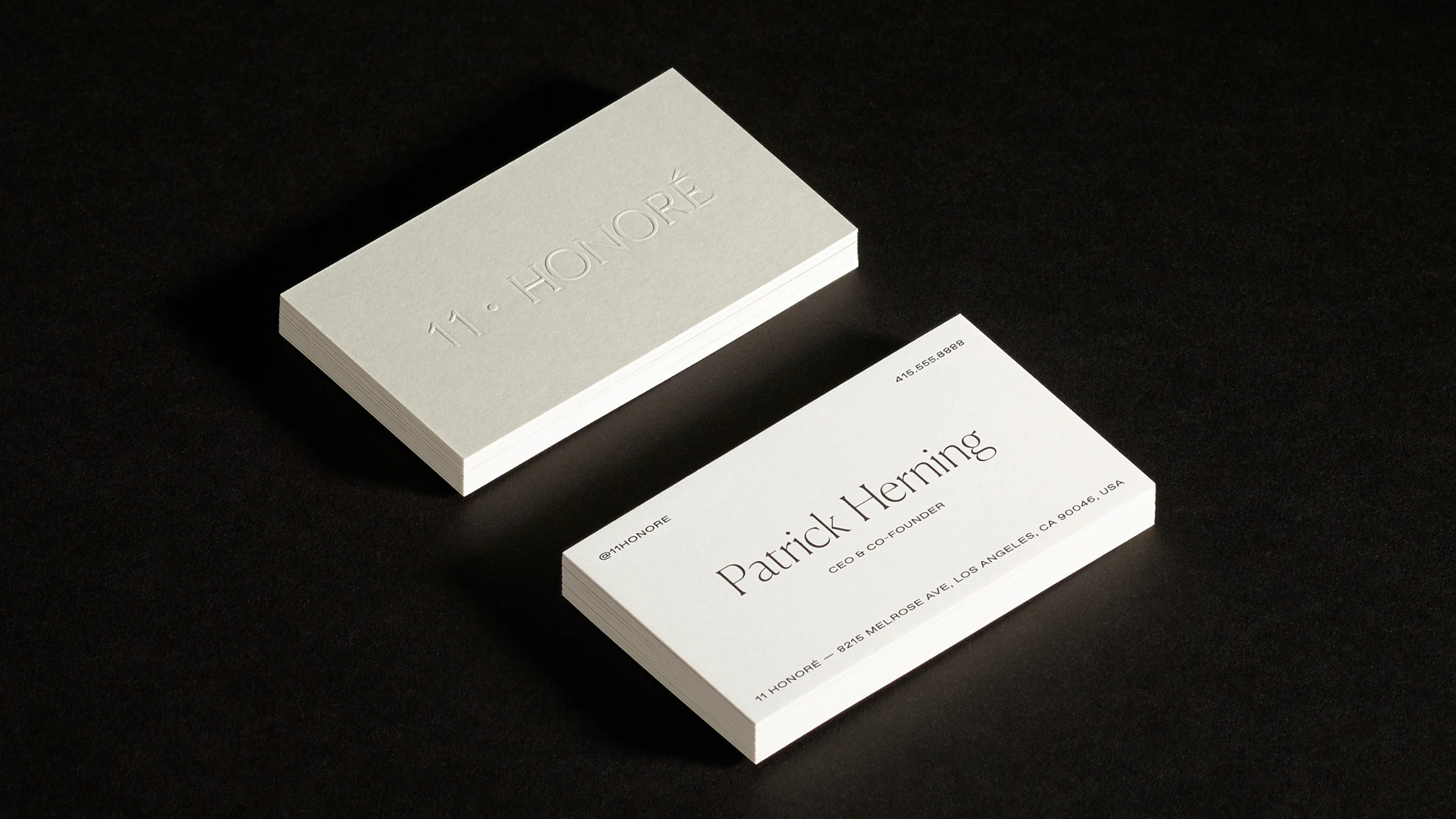 Close up of Patrick Herning custom embossed business card, print design and branding by RoAndCo