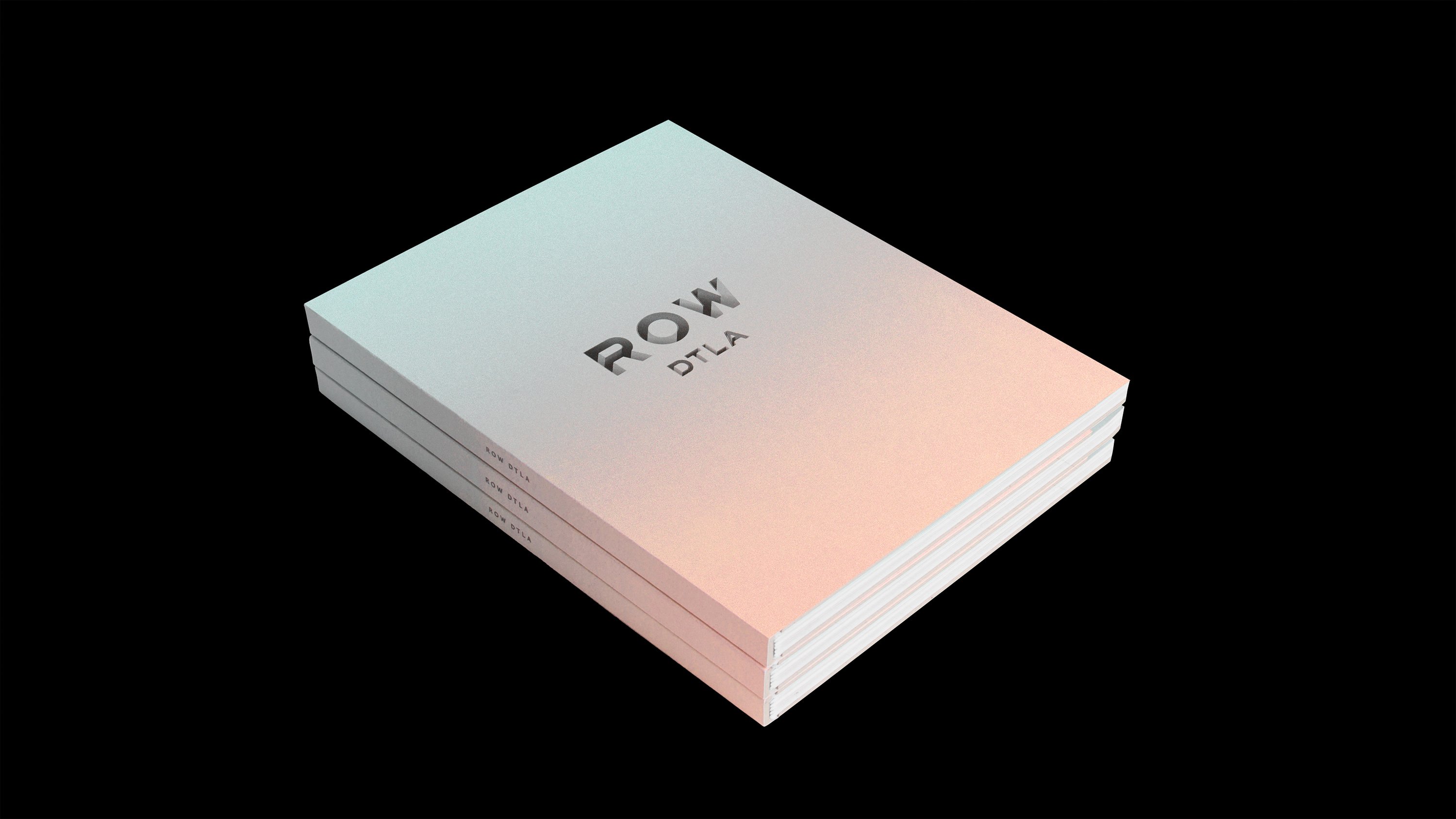 Row DTLA Brand Book stack, branding and print design by RoAndCo