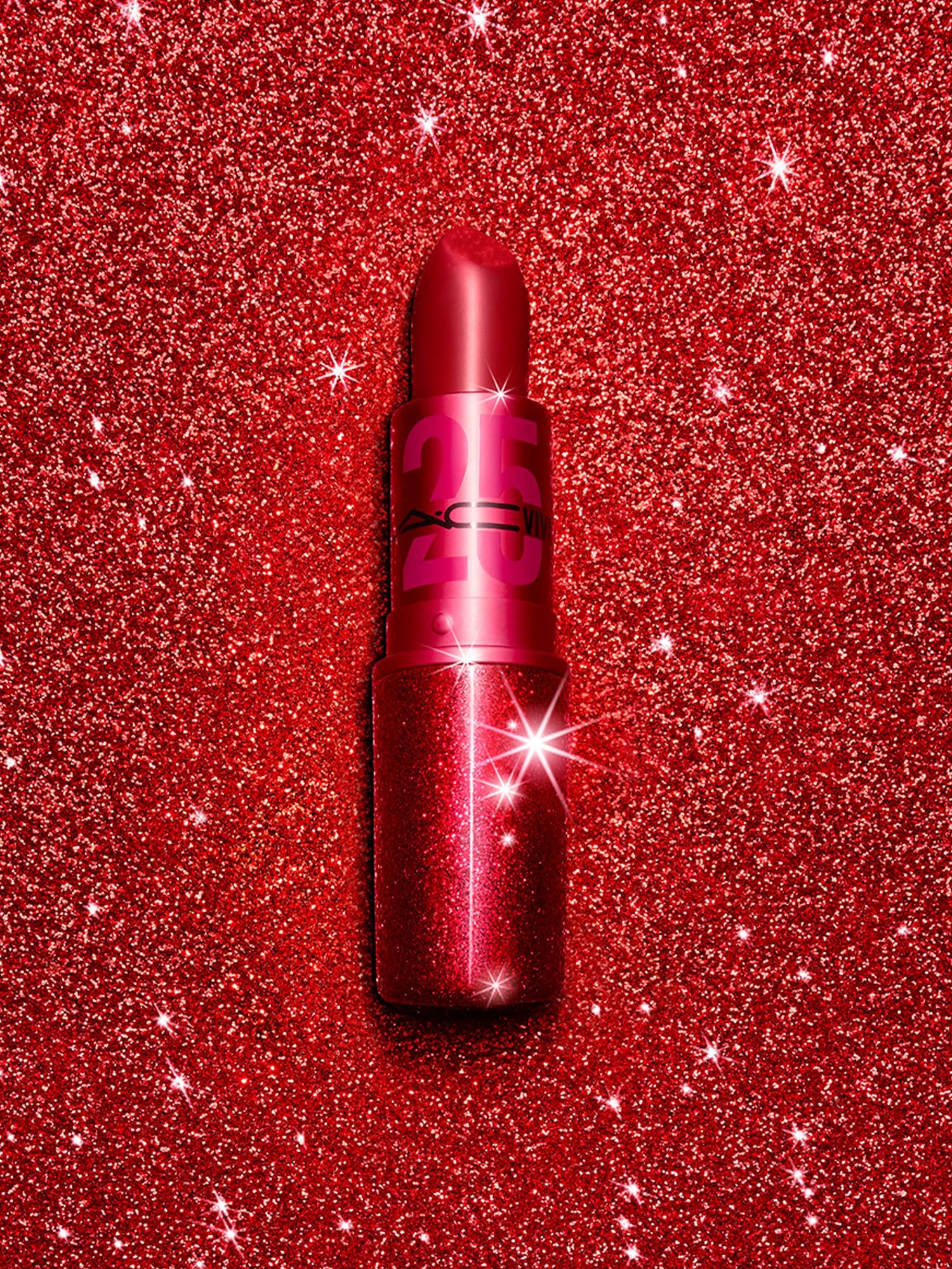 Close up of limited edition 25th Anniversary red lipstick on red glitter background, by RoAndCo Studio