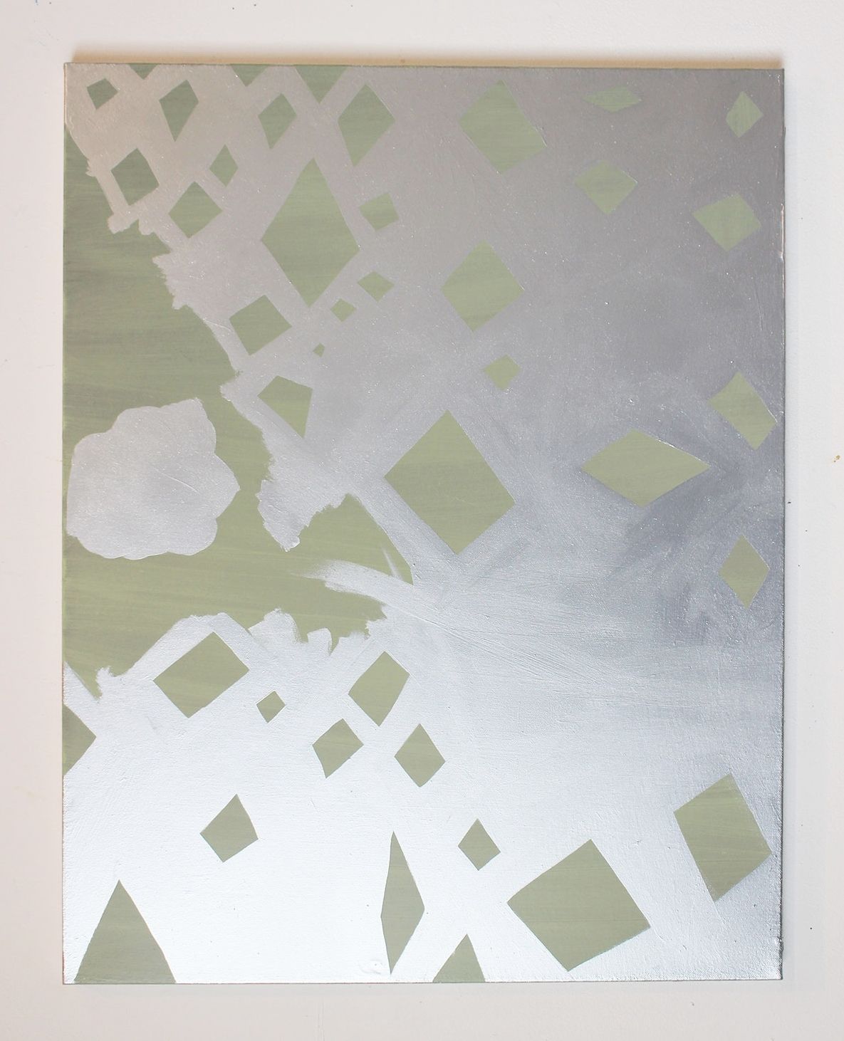 Abstract image with geometric patterns in silver and muted green tones, featuring diamond shapes and cut-out sections.