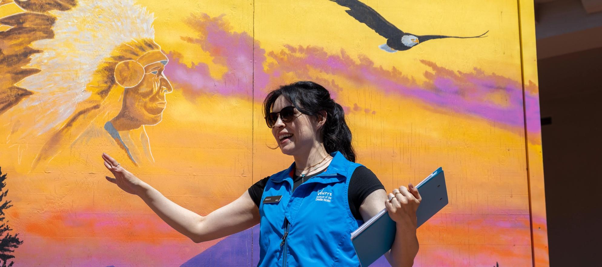 Mural artwork by Gordon Wesley. Tour guide and artist Kristy North Peigan.