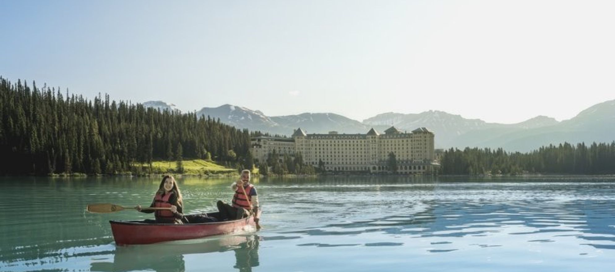 Canoeing on Lake Louise on a sunny day.