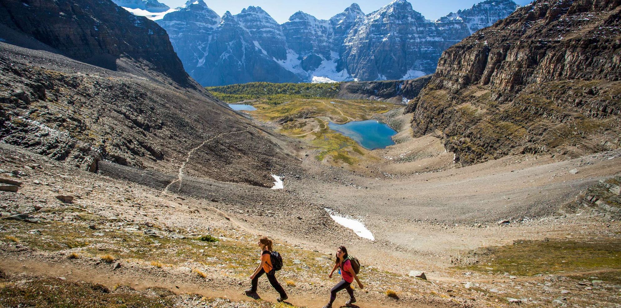 Hikers explore the stunning Sentinel Pass outside of Moraine Lake, AB.