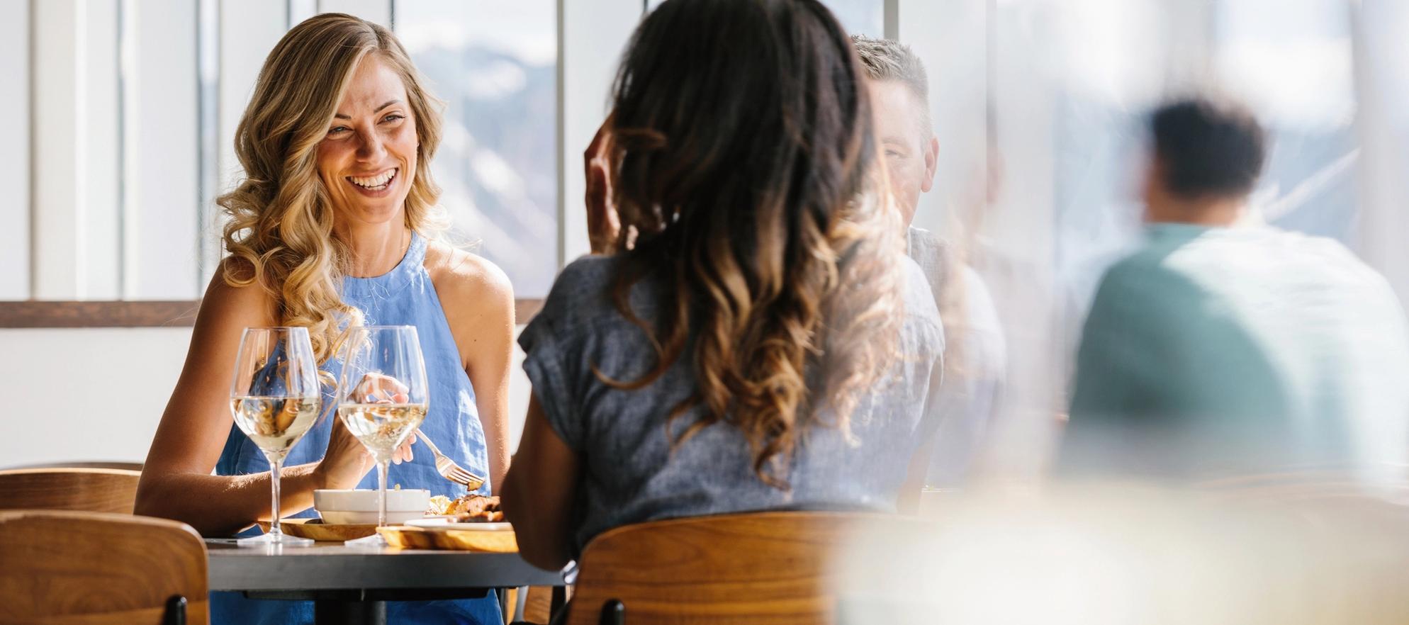 Woman enjoying her food and drinks at the Banff Gondola