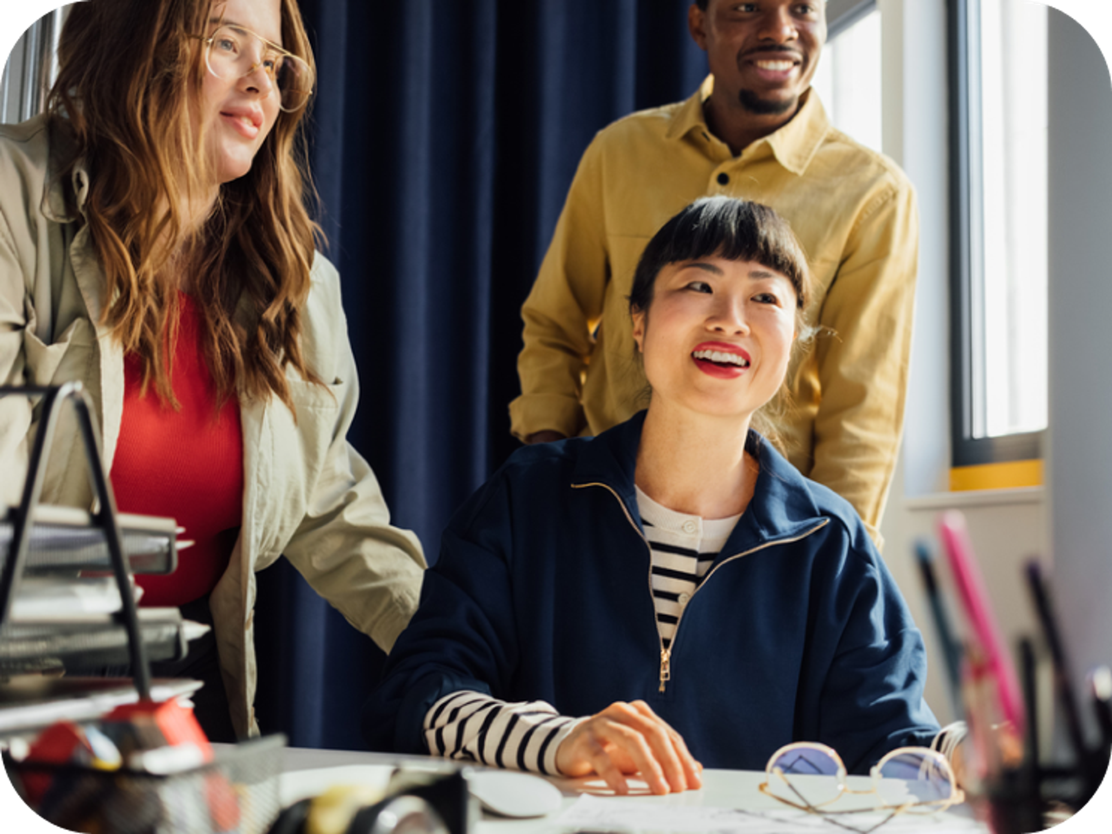 A photo of a woman looking at a phone and excerpt screens of the Penfold team messaging employees
