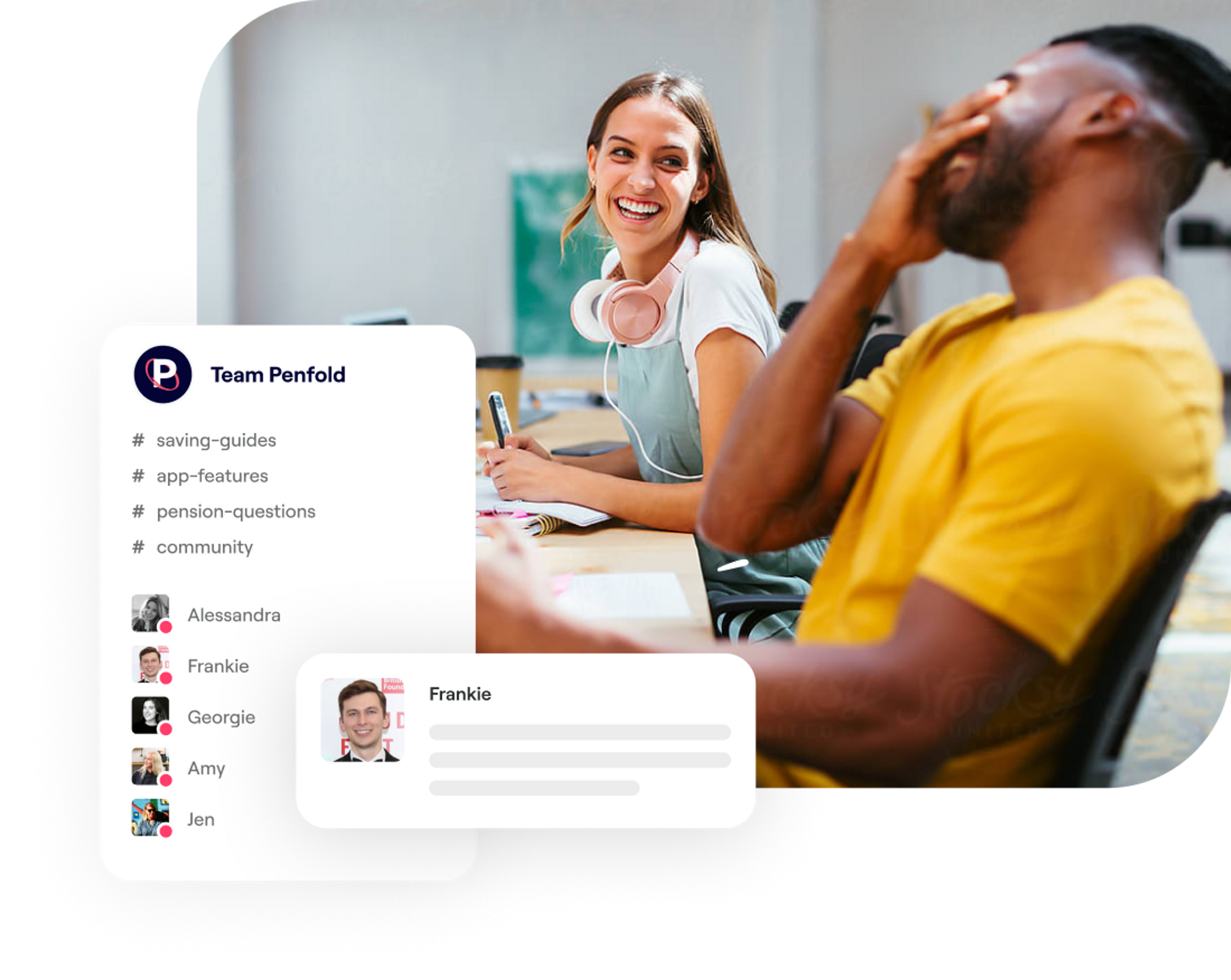 A photo of a man and a woman laughing while sat at a desk
