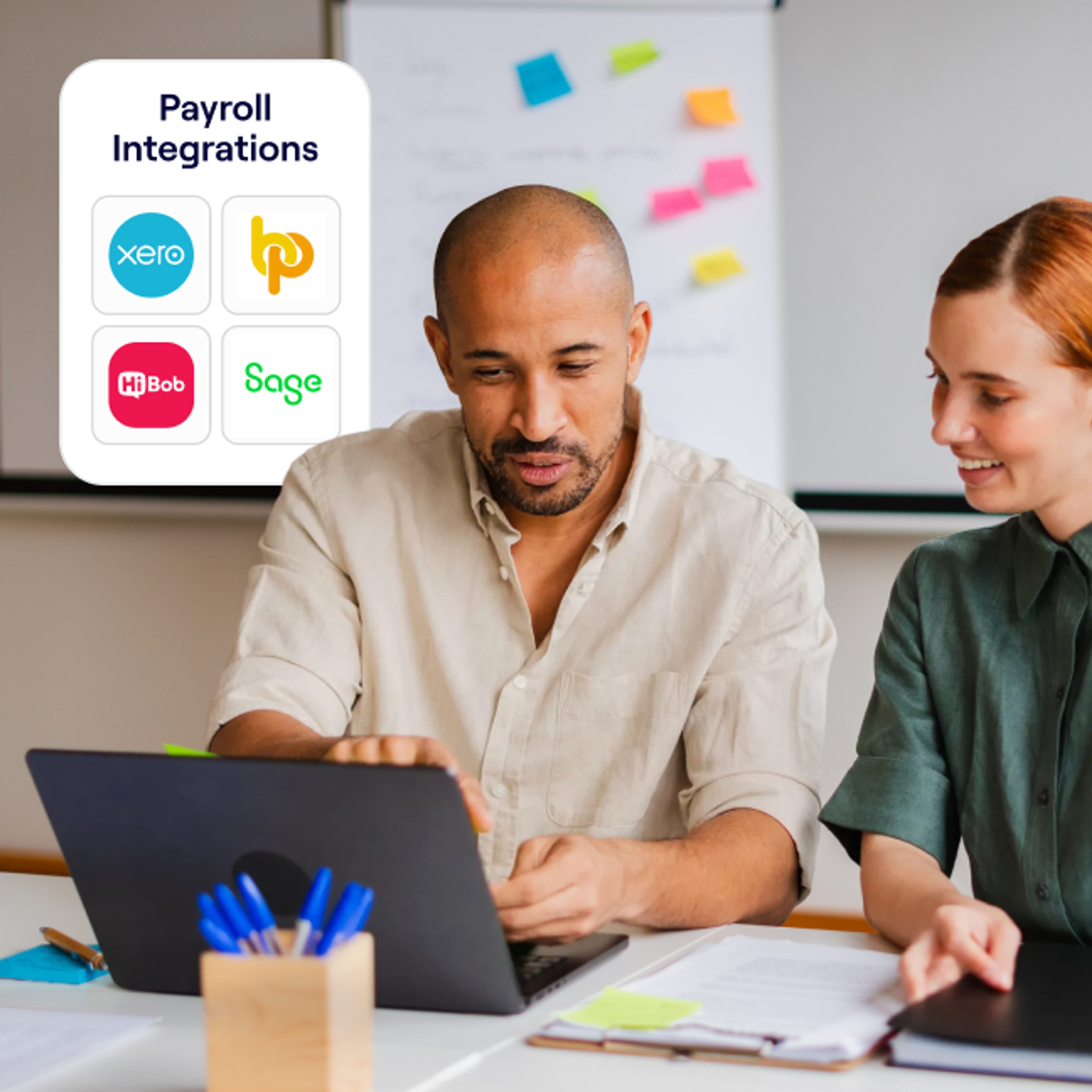 Two colleagues review content on a laptop in a meeting room, with a whiteboard in the background and an overlay showing supported payroll integrations including Xero, HiBob, Sage, and another unnamed logo.