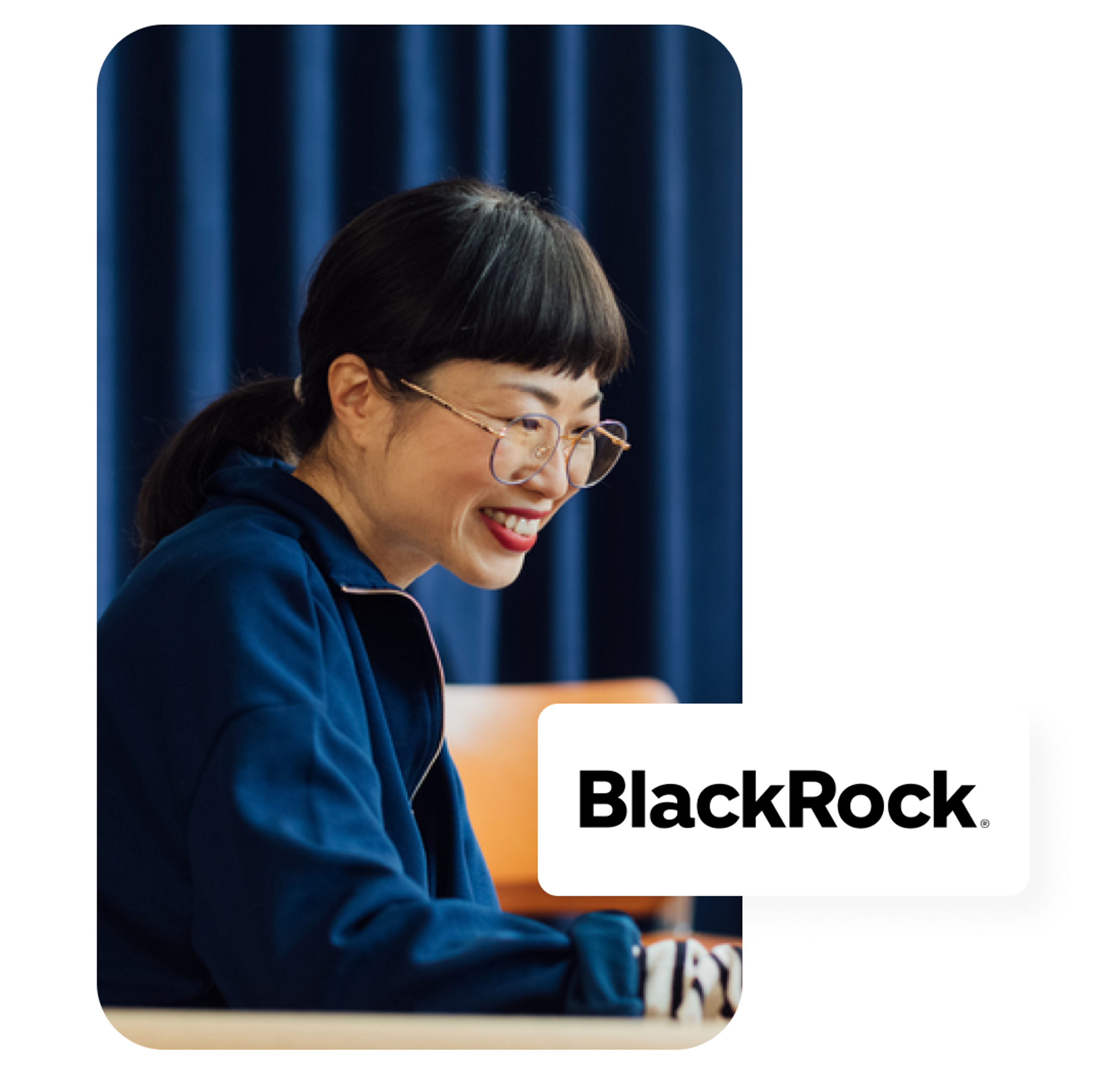 A photo of a woman smiling while looking at a laptop and the BlackRock logo