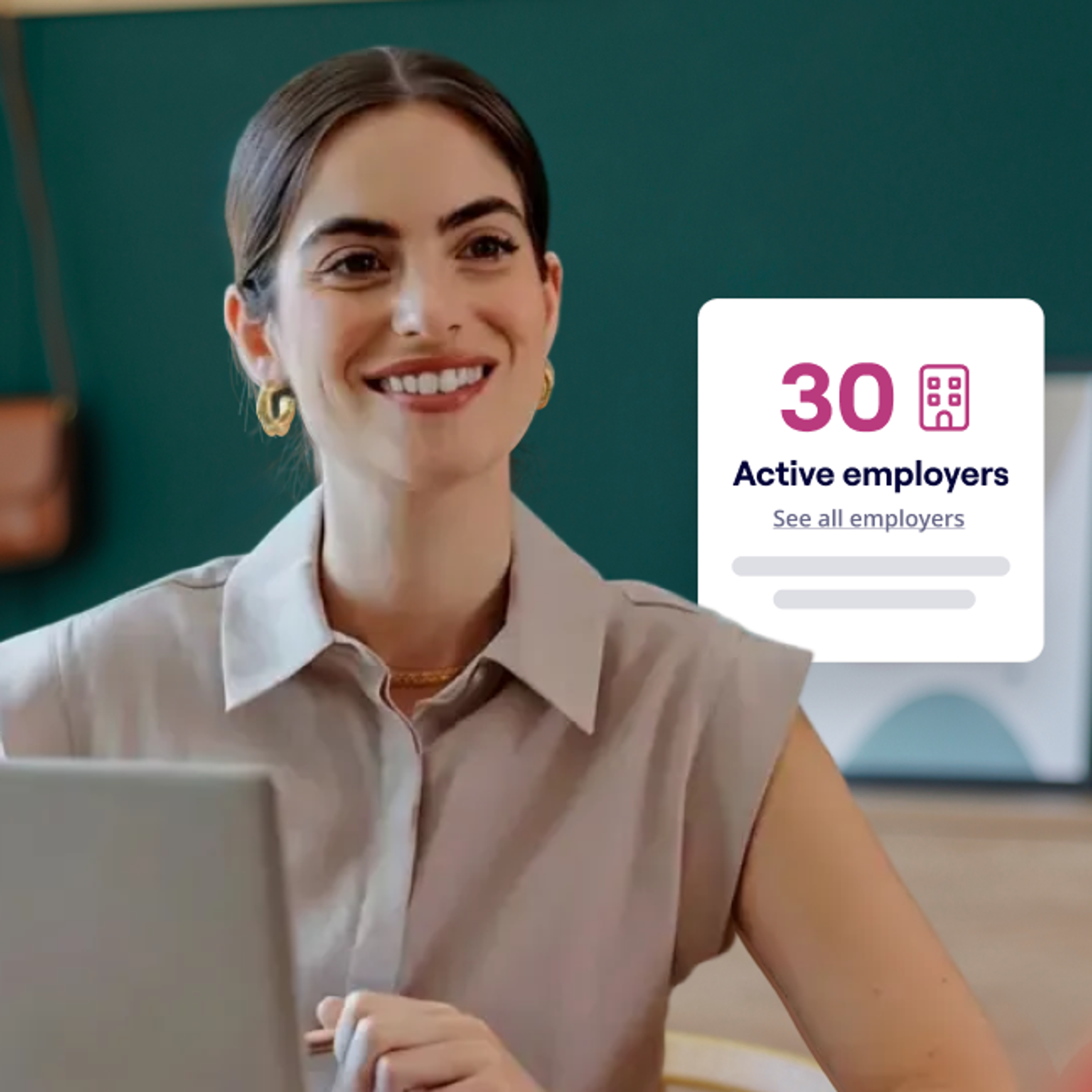 A smiling woman sits at a laptop in a modern office with a green background, while an overlay displays “30 active employers” with a link to see all employers.