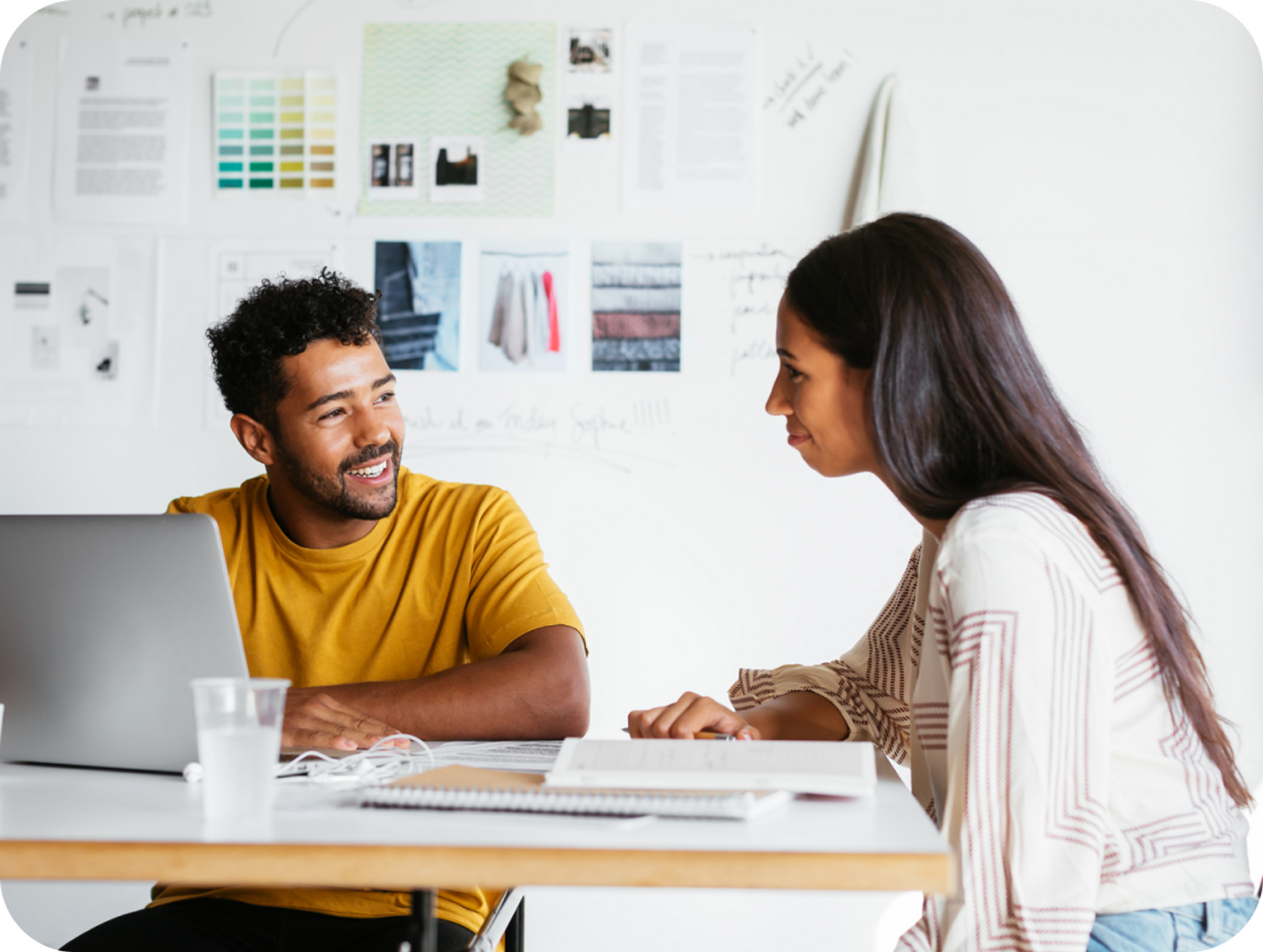 A photo of a man and a woman sat down having a conversation