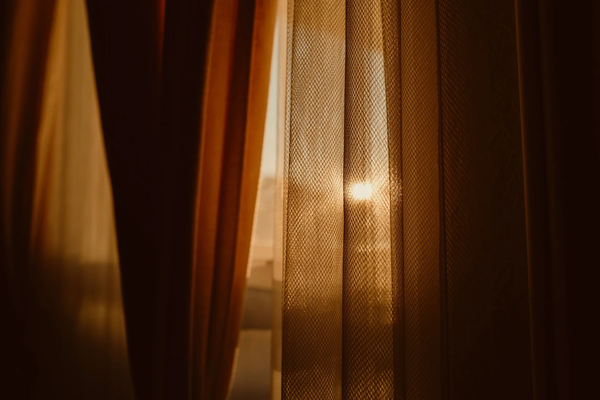 Sunset seen through curtains