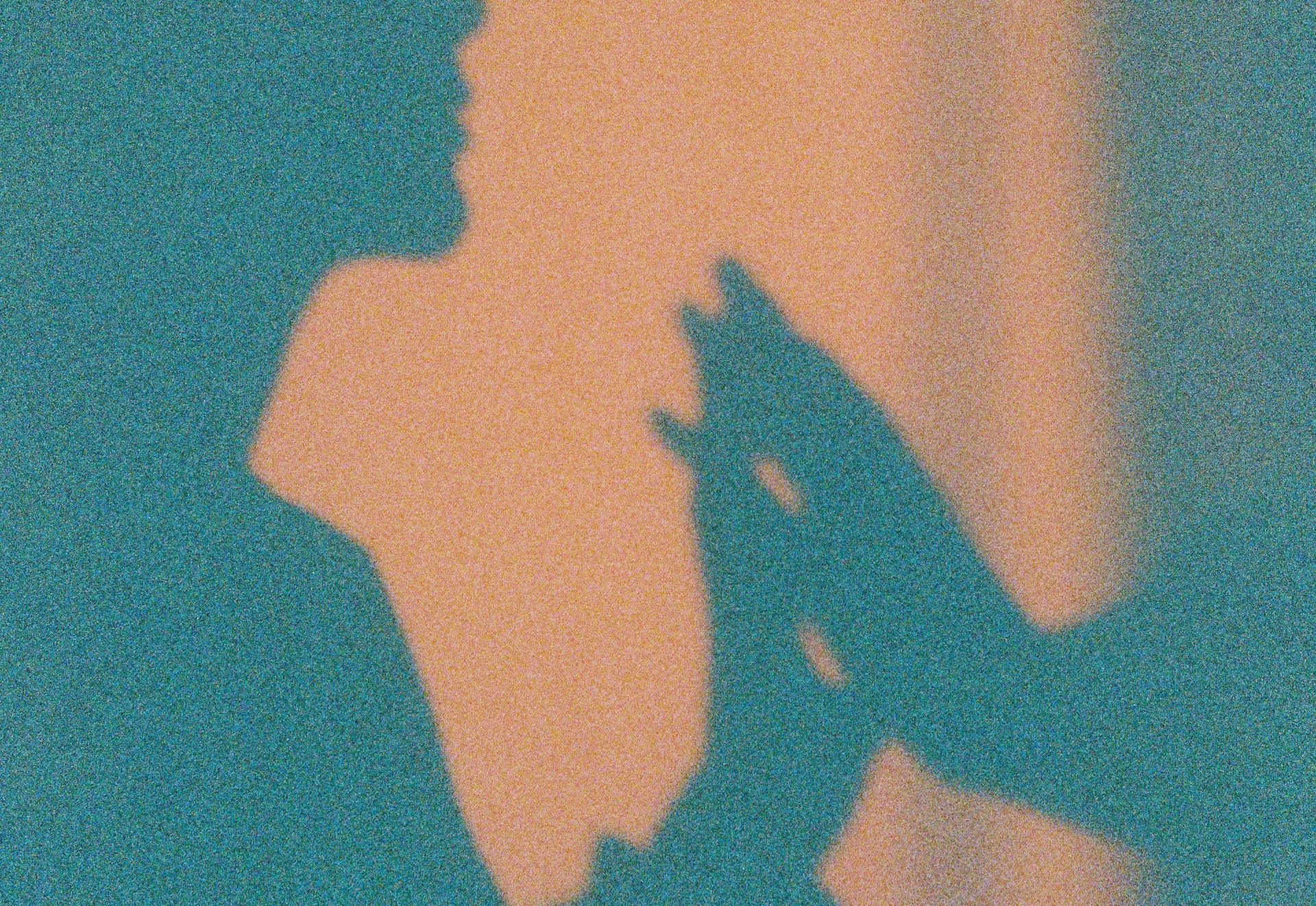 SShadow of two people pressing their hands together