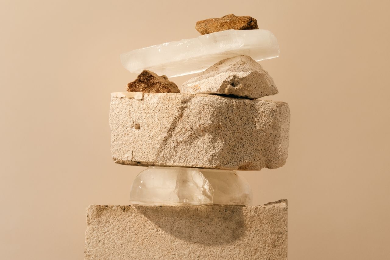 Different types of stones in earthy tones stacked on top of each other