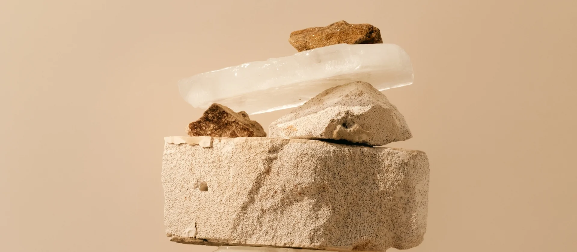 Different types of stones in earthy tones stacked on top of each other