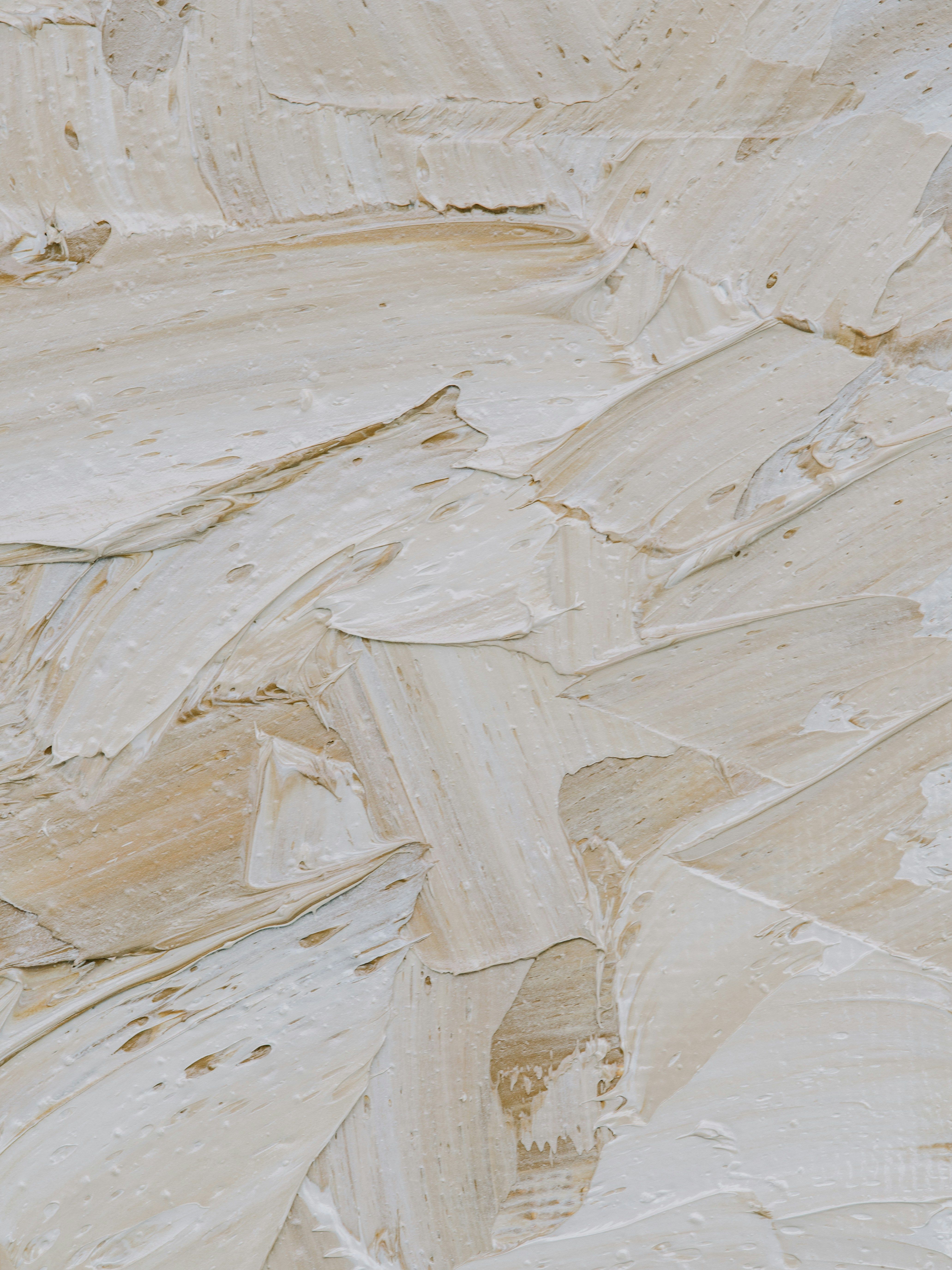 Woman sitting cross-legged, only part of knee, arm, and foot visible, with a sage bundle for smudging in front of her