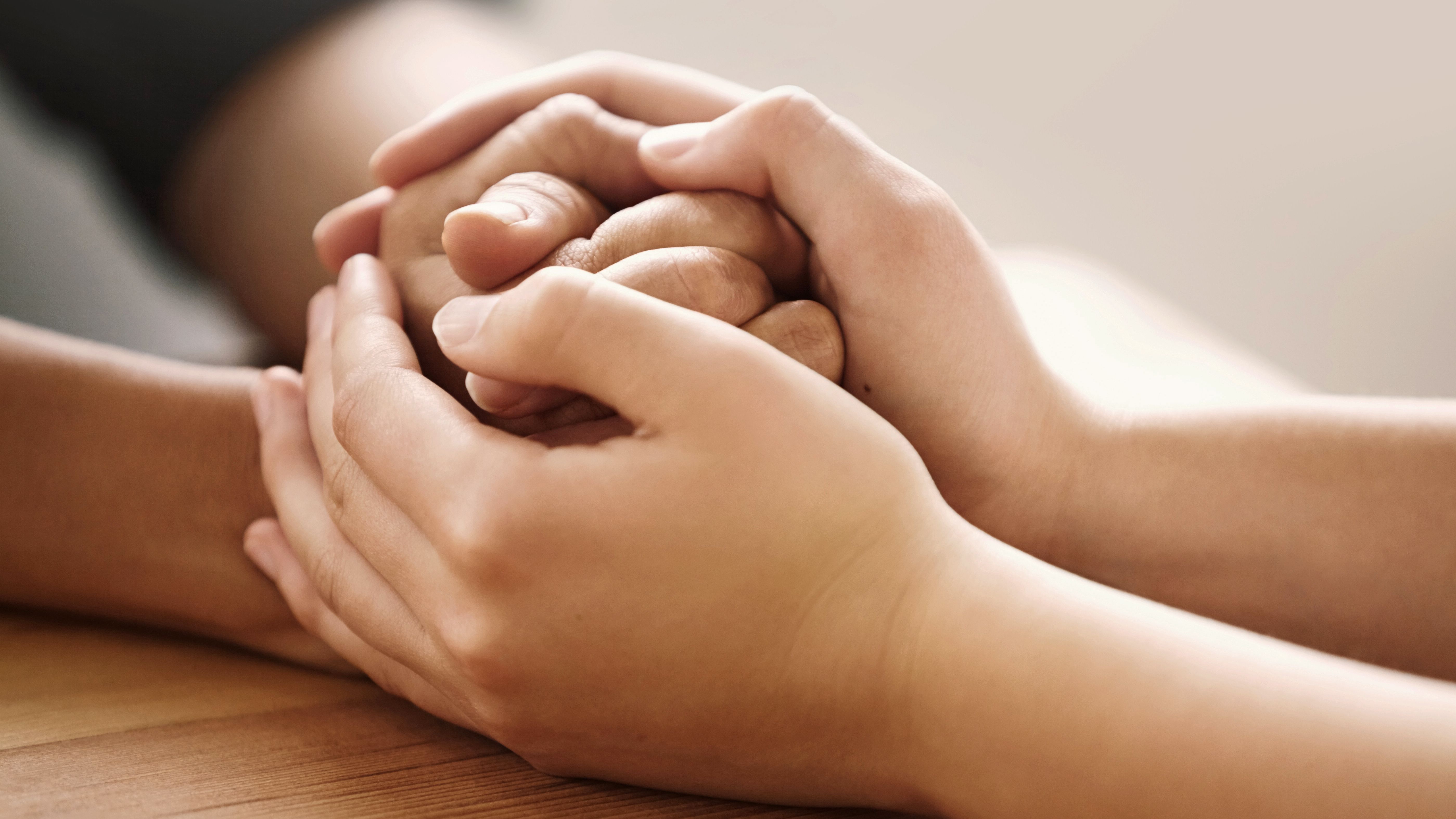 Hands Holding in Care