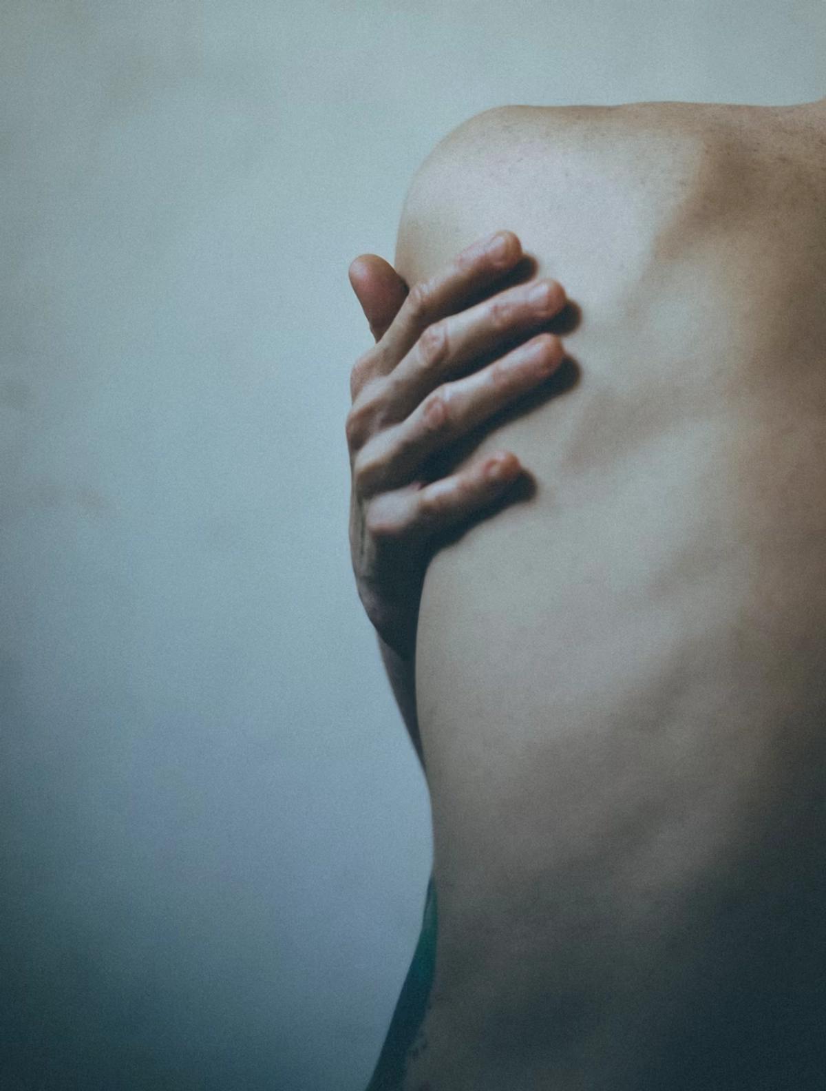 Hand on a back