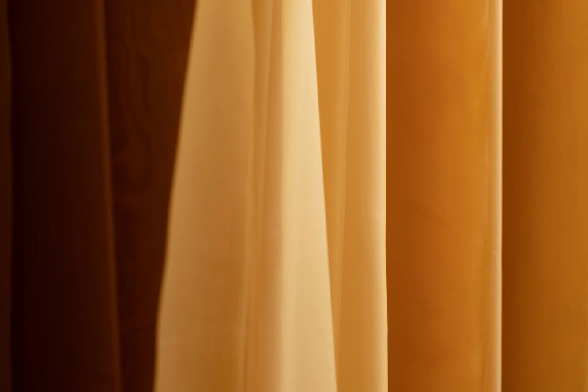 Curtain bathed in orange light
