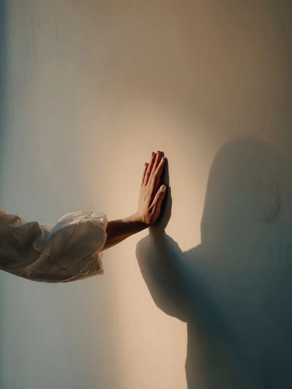 Hand on the wall with a spotlight on it - Your future is yours to shape