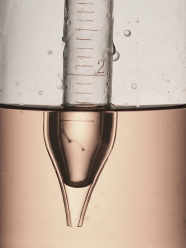 Measuring cup filled with liquid - Longevity & Rejuvenation