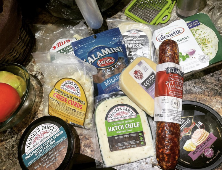 Cheese and meats on a counter