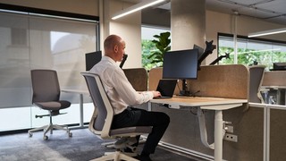 Ben Moxey sitting at a computer.