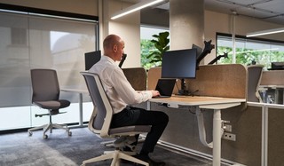 Ben Moxey sitting at a computer.