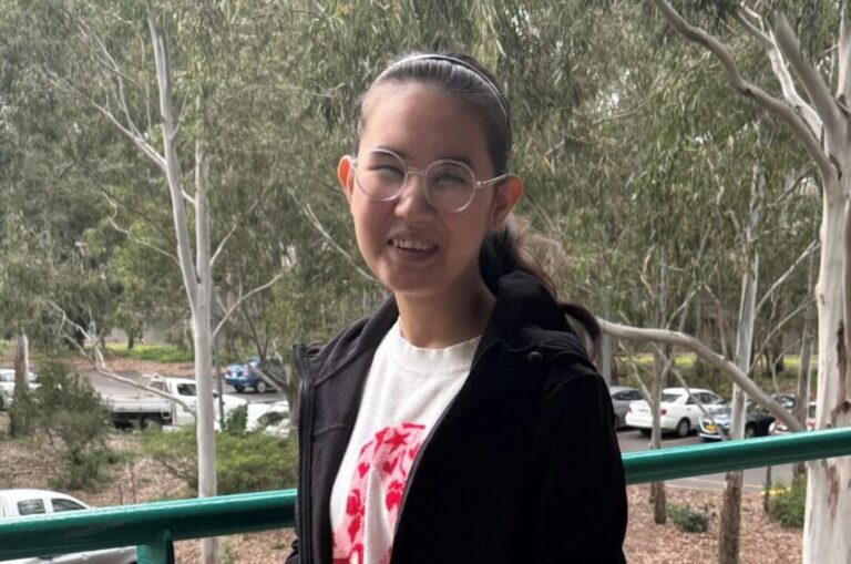 Samira smiling at the camera.