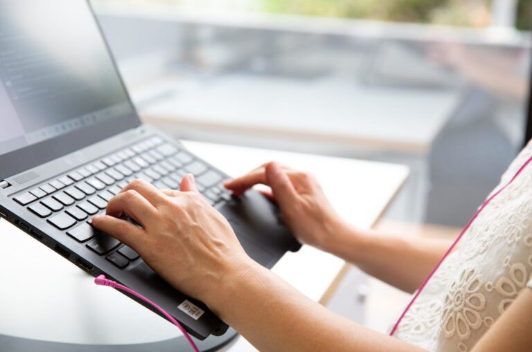 A person using a laptop.