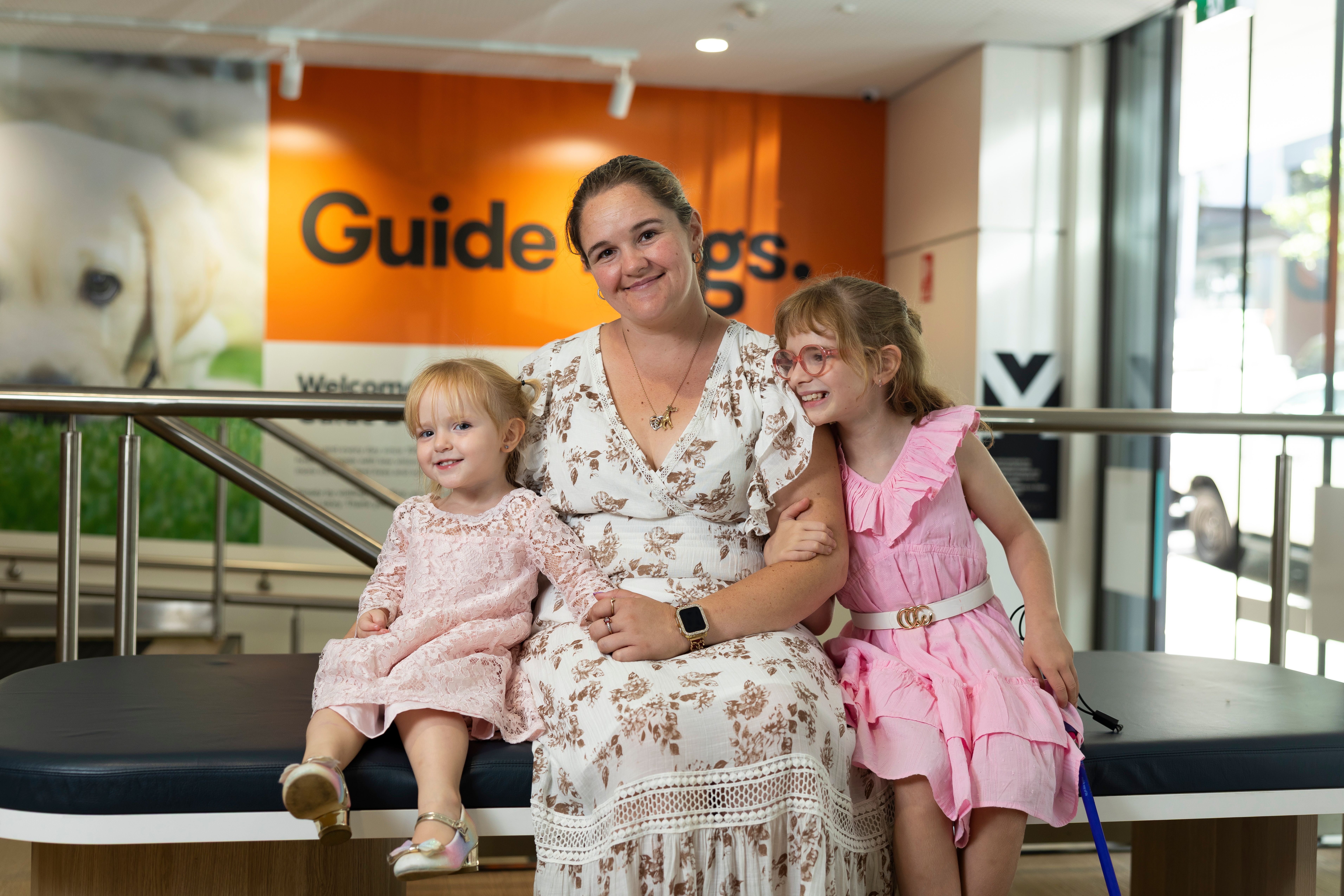 A mother and her two daughters.