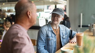 A Client sitting at a cafe.