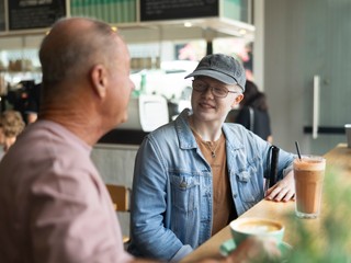 A Client sitting at a cafe.